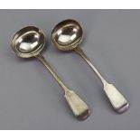 A pair of Victorian silver fiddle pattern sauce ladles, George W Adams, London 1881, 5ozs.