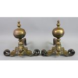 A pair of brass and wrought metal fire dogs in 17th century style, late 19th century,