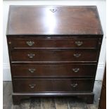 A George III mahogany bureau, the hinged fall enclosing a fitted interior, four long drawers below,