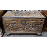 A Chinese carved camphorwood chest, late 19th/early 20th century,