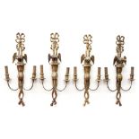 A set of four carved giltwood wall applique, early 19th century,