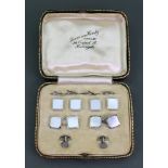 A cased gentleman's white gold and mother of pearl dress set, comprising; four buttons,