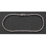 A white gold and diamond tennis bracelet, each brilliant cut diamond approx. 0.