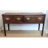 A George III oak low dresser, the rectangular top above two frieze drawers,