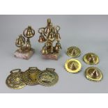 A collection of sixteen Victorian and later horse brasses, four buckler shape brasses, two swingers,