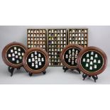 Thimbles in four circular wood display cases: Westbury studio 'gem' tops and floral,