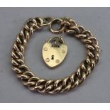A 9ct gold, curb link bracelet, with heart shaped lock and safety chain, 50.70g gross.