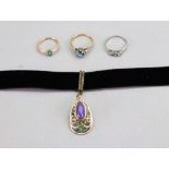 An opal and enamel pendant mounted to velvet choker, a three stone diamond ring,