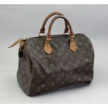 Louis Vuitton; a Speedy 30 monogram canvas handbag, with branded padlock and gilt metal hardware,