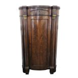 A Biedermeier mahogany floor standing bowfronted corner cabinet,