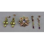A 9ct gold, amethyst and green gemset floral motif brooch,