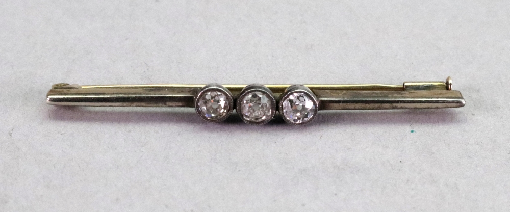 A diamond bar brooch, the three old cut diamonds millegrain set to the centre of the knife wire, 3.