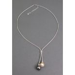 A gold, Tahitian grey-tinted cultured pearl and cultured pearl double drop necklace,