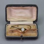 An Edwardian opal set bar brooch, detailed 9ct, the opal stone within scrolled bars, 6cm wide.
