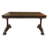 A William IV rosewood library table, the rectangular top with rounded corners,