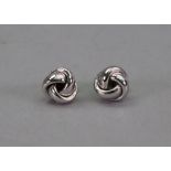 A pair of white gold interwoven knot design stud earrings, stamped 750, 5.52g gross.