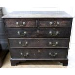 A George III oak chest, the moulded rectangular top above two short and three long drawers,