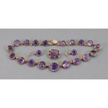 A Victorian gold and amethyst necklace, earring and brooch suite,