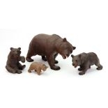 A collection of four Black Forest carved linden wood figures of bears, late 19th/early 20th century,