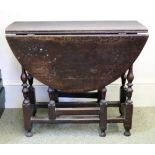 A late 17th/early 18th century oak gateleg table, with hinged oval top, later end drawer,