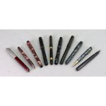 A collection of vintage fountain pens and pencils including a Conway Stewart 388 fountain pen and