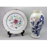A Chinese Export famille rose charger, Qianlong, enamelled in the centre with flowering branches,