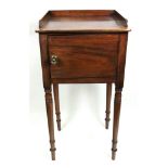 A Regency mahogany pot cupboard, with three quarter gallery, enclosed by a single door,