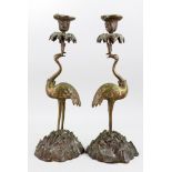 A pair of Early Victorian gilt metal candlesticks,