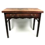 A George III mahogany tea table, with hinged rectangular fold over top, frieze drawer,