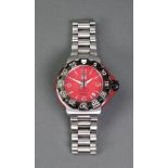 Tag Heuer; a gentleman's red Formula 1 stainless steel quartz bracelet wristwatch,