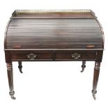 A William IV mahogany cylinder front desk, with pierced brass gallery,