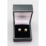 A pair of 18ct gold and brilliant cut diamond single stone ear studs, the diamonds approximately 0.