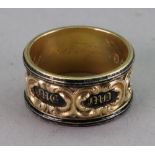 An 18ct gold and black enamel mourning ring, band 10.60mm wide, ring size P, 7.88g gross.