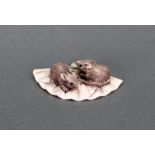 Three Japanese netsuke comprising: Two rats resting on a fan, 5cm wide, signed, a group of rats,