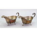 Two similar George III style silver helmet sauce boats, William Hutton & Sons, Sheffield 1932,