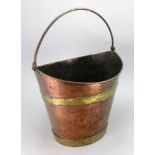 A reproduction George III style navette shape copper and brass bound bucket, with swing handle,