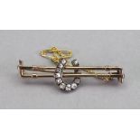 A gold and diamond brooch,