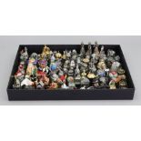 Thimbles: Metal whimsical and many containing tiny figures, carousel, rainbow coins, telephone,