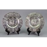 A near pair of ornate Dutch silver cigar ashtrays, early 20th century,