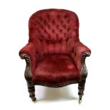 A Victorian walnut frame armchair, circa 1860, button down upholstered in claret velour,