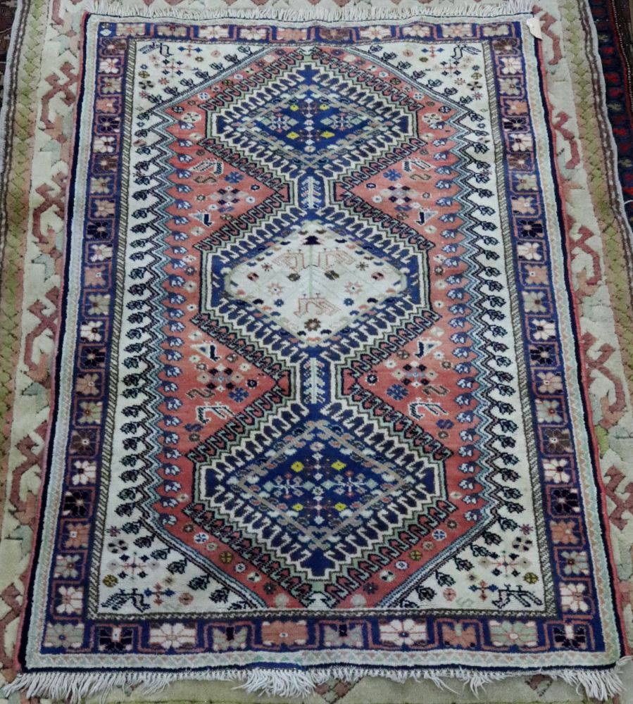 A North West Persian rug, with three joined lozenge medallions, 140 x 98cm, and another rug,