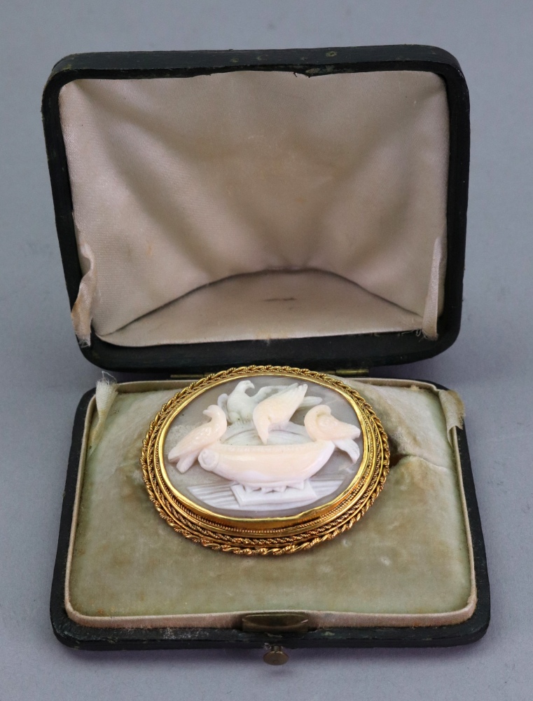 A Victorian gold mounted shell cameo brooch, carved as Pliny's doves drinking from a bowl, - Image 2 of 2