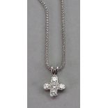 An 18ct white gold and diamond cross pendant, the five round brilliant cut diamonds set in a cross,