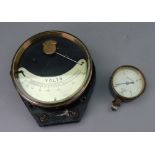 A brass cased voltsmeter with silvered scale and black glazed backplate,