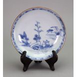 The Nanking Cargo; a Chinese blue and white saucer, painted with a landscape scene,