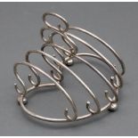 An Edwardian silver wire work five bar toast rack, Henry Williamson Ltd, Birmingham 1905,