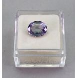 A synthetic colour change sapphire, 9.50mm x 7.56mm x 4.06mm.