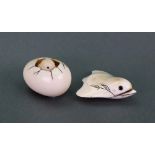 A Japanese ivory netsuke, 20th century, in the form of a chick emerging from a broken egg, signed,