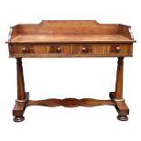 An early Victorian mahogany dressing table, the three quarter gallery above two frieze drawers,