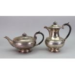 A compressed circular silver teapot and matching hot water pot, Walker & Hall, Sheffield 1933,